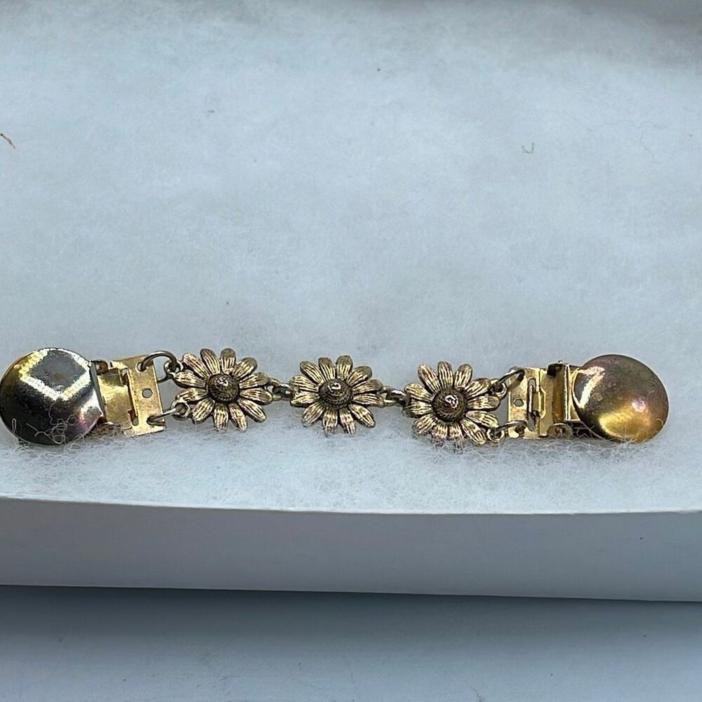 Vintage sunflower cape sweater clip.